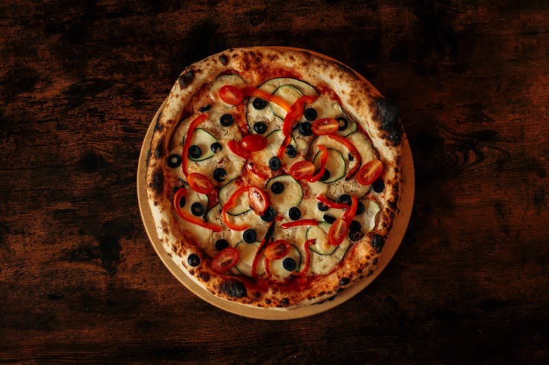 Community pizza night event with guests enjoying